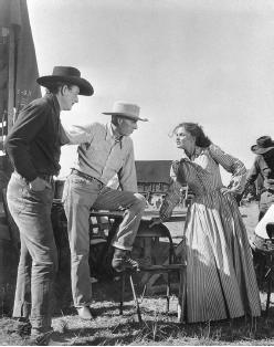 Howard Hawks (center), John Wayne, and Joanne Dru on the set of Red River