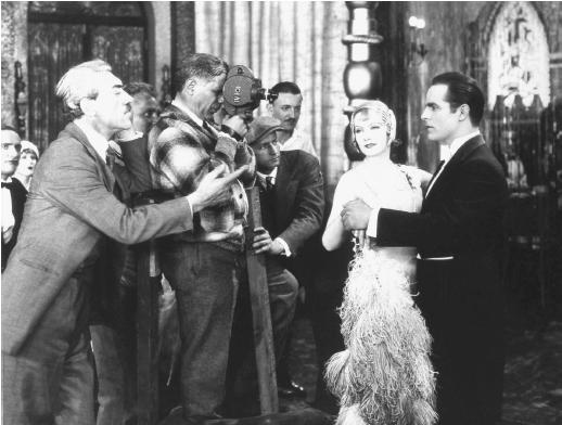 Mauritz Stiller (left) directing Greta Garbo and Antonio Moreno