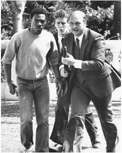 Eddie Murphy (left), Judge Reinhold (center), and John Ashton in Beverly Hills Cop