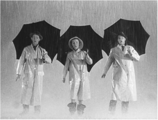 Debbie Reynolds with Gene Kelly (right) and Donald O'Connor in Singin' in the Rain